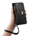 iPhone 16 Pungetui med blomster- og bladmønster med lynlåslomme og håndledsrem - Sort